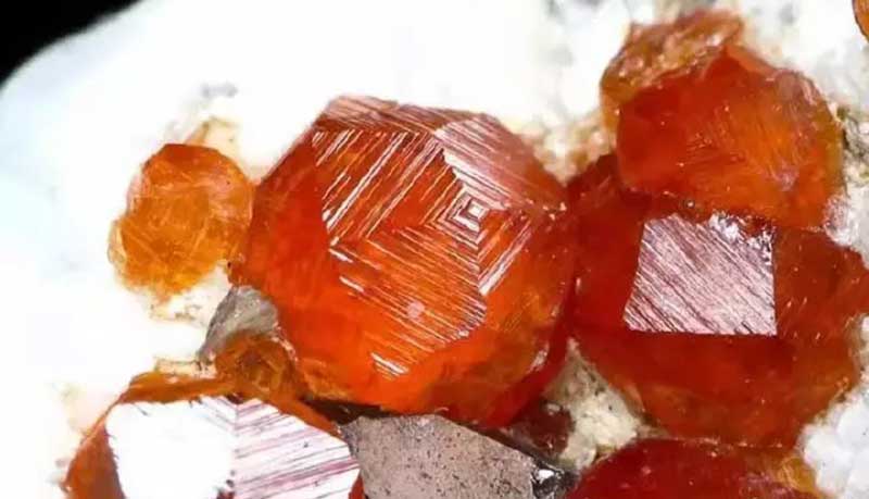 Bright orange-red Fanta garnet crystal, valued for its vivid color and natural beauty.