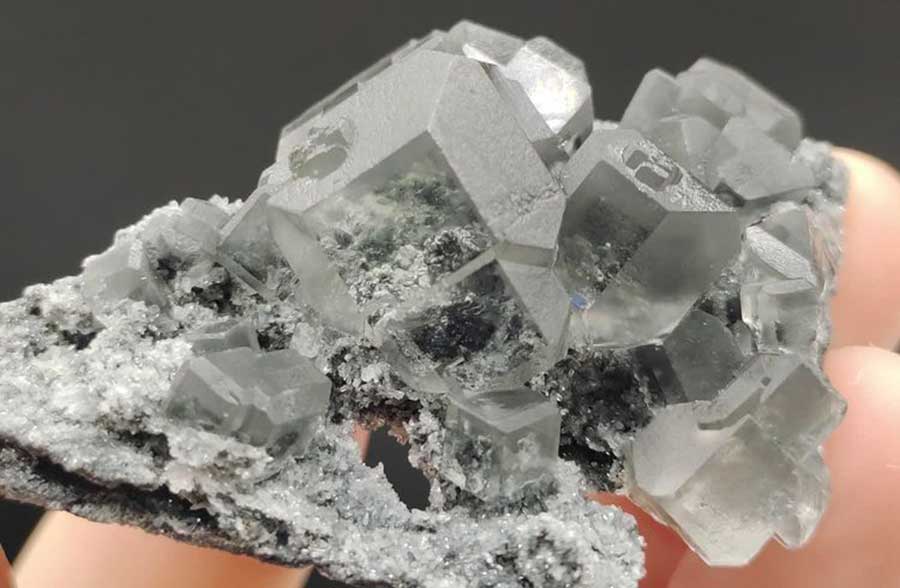 A natural fluorite mineral specimen with transparent crystal formations. Ideal for collectors, display, or educational purposes.