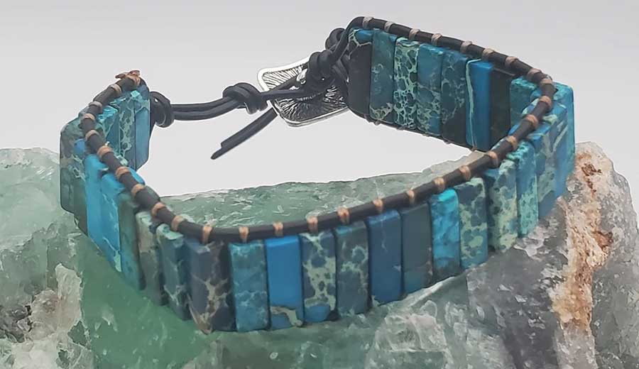 Boho-style leather gemstone bracelet featuring blue and green rectangular stones. 