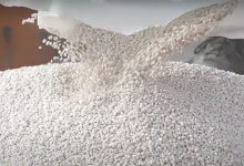 pouring Ammonium Chloride granules from the bag