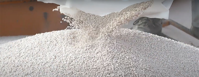 pouring Ammonium Chloride granules from the bag